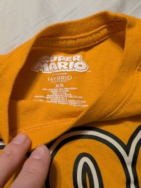 GLOW IN THE DARK Nintendo Super Mario Tee in Orange with Black and White Graphic